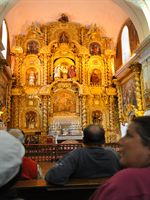 Altaret av guld i katedralen i Cusco